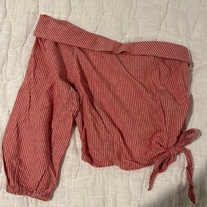 Off-the shoulder asymmetric red and white striped crop top from free people.